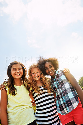 Buy stock photo Portrait of a group of diverse and happy kids hanging out together on a bright day outside