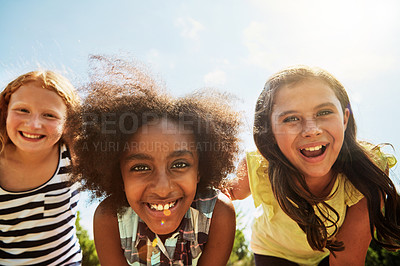 Buy stock photo Portrait of a group of diverse and happy kids hanging out together on a bright day outside