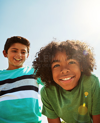 Buy stock photo Portrait of two happy young friends hanging out together on a bright day outside