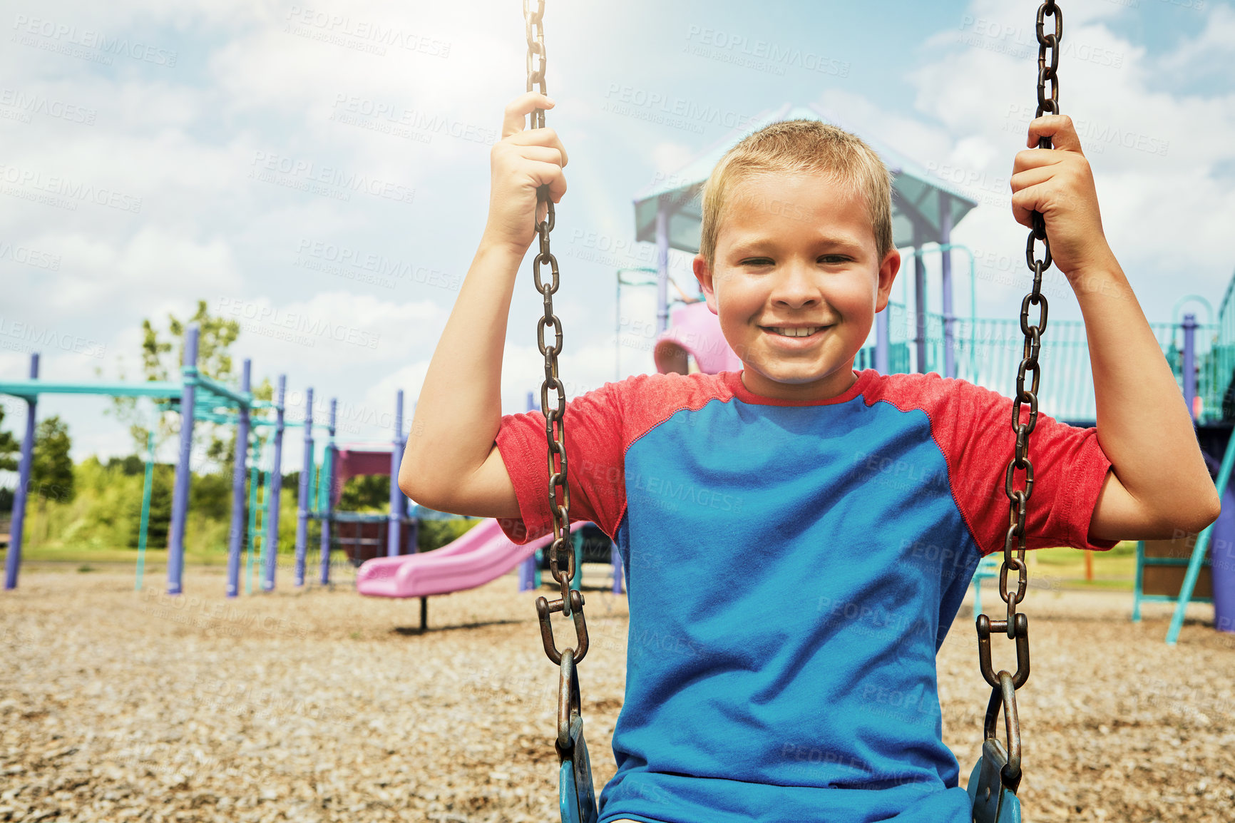 Buy stock photo Boy, portrait and smile with park, swing and nature for outdoor fun and play with fresh air. Child, tree and playground with summer, freedom and school holiday or break outside with happiness