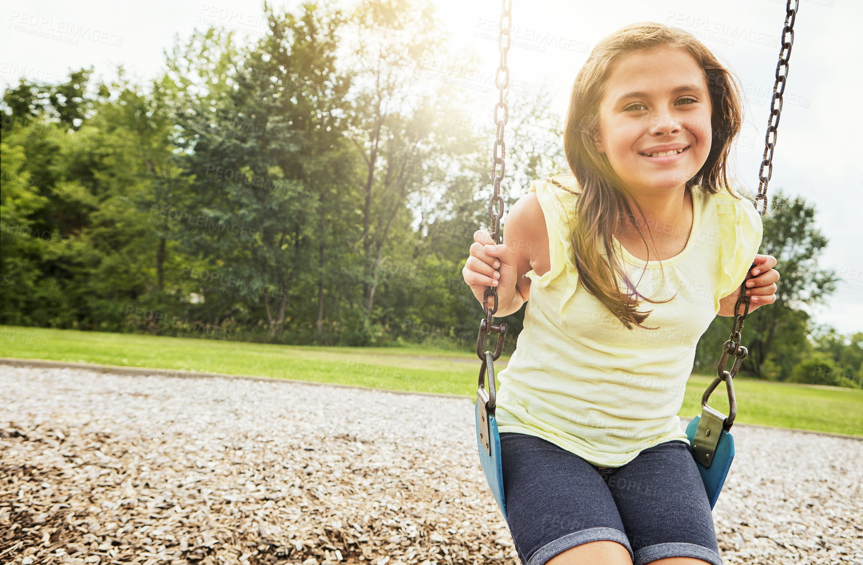 Buy stock photo Girl, portrait and play with park, swing and nature for outdoor fun and smile with fresh air. Child, tree and playground with summer, freedom and school holiday or break outside with happiness