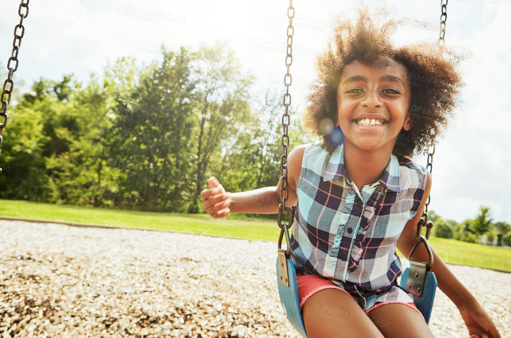 Buy stock photo African girl, portrait and smile with swing, park and nature for outdoor fun or play with fresh air. Child, joy and playground with summer, freedom and school holiday or break outside with happiness