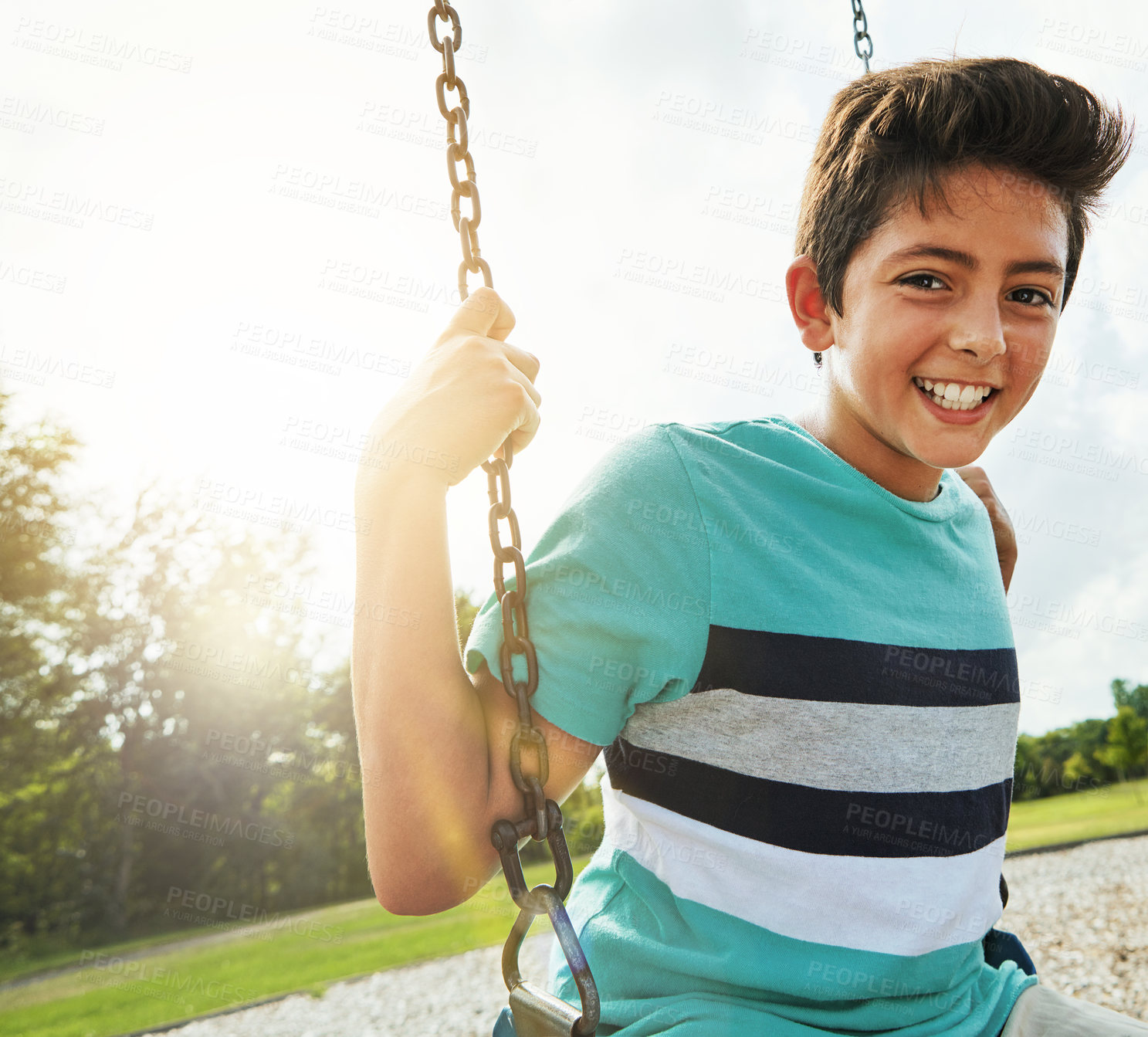 Buy stock photo Boy, portrait and smile with playground, swing and nature for outdoor fun and play with fresh air. Child, tree and park with summer, freedom and holiday or youth break outside with happiness