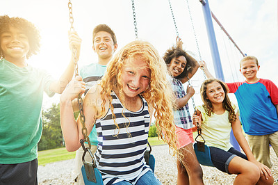 Buy stock photo Portrait of a group of young children playing together at the park