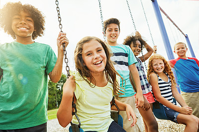 Buy stock photo Portrait of a group of young children playing together at the park