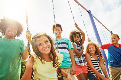 Buy stock photo Cropped shot of a group of young children playing together at the park