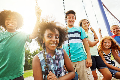 Buy stock photo Portrait of a group of young children playing together at the park