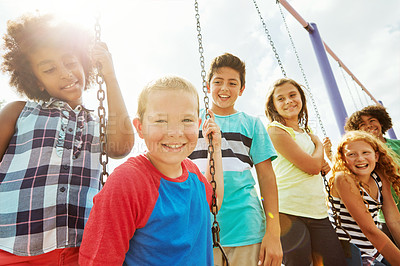 Buy stock photo Cropped shot of a group of young children playing together at the park