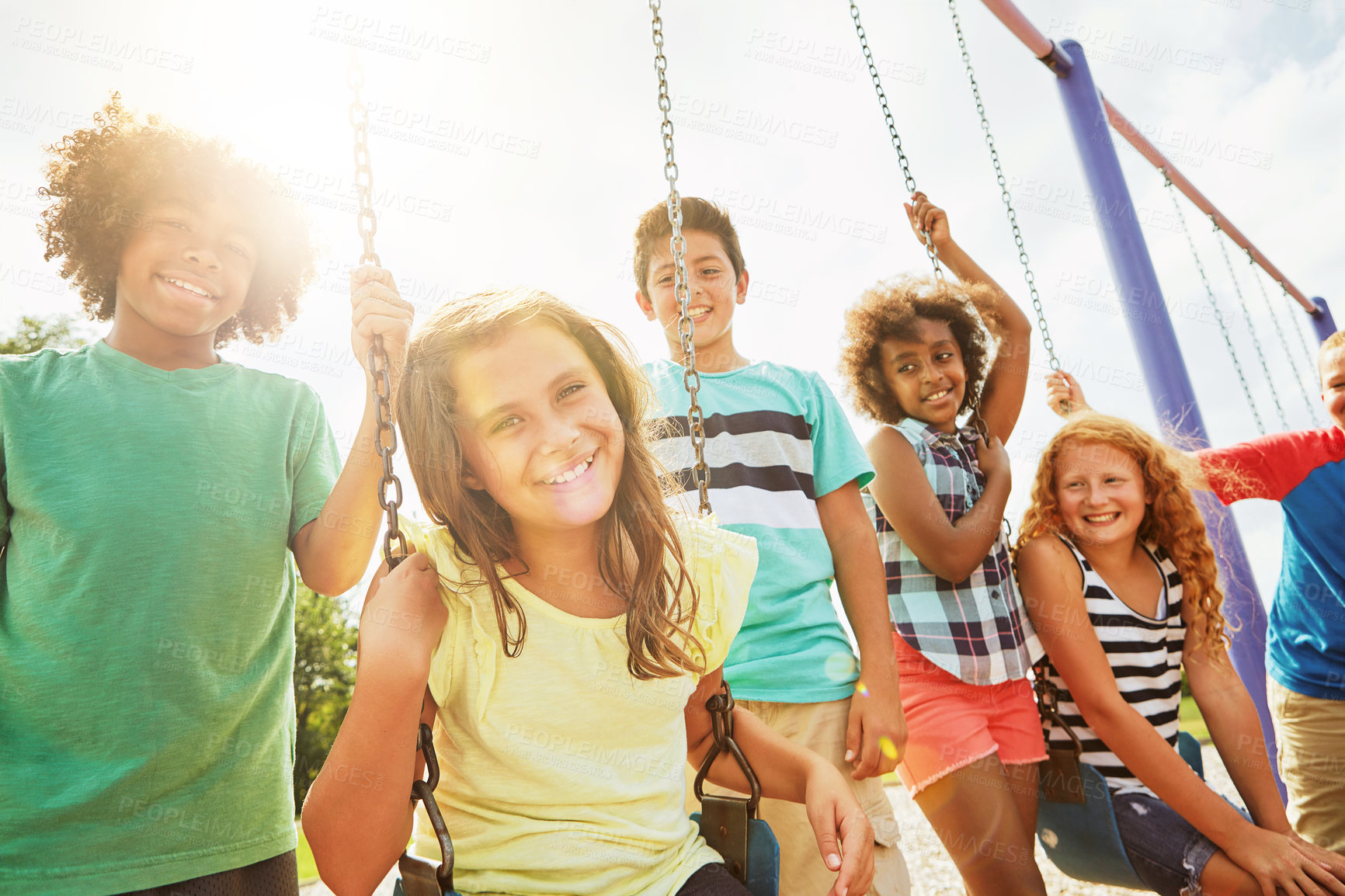 Buy stock photo Cropped shot of a group of young children playing together at the park