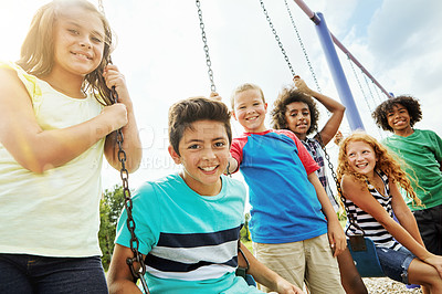 Buy stock photo Portrait of a group of young children playing together at the park