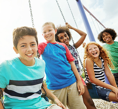 Buy stock photo Cropped shot of a group of young children playing together at the park