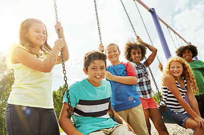 Buy stock photo Cropped shot of a group of young children playing together at the park