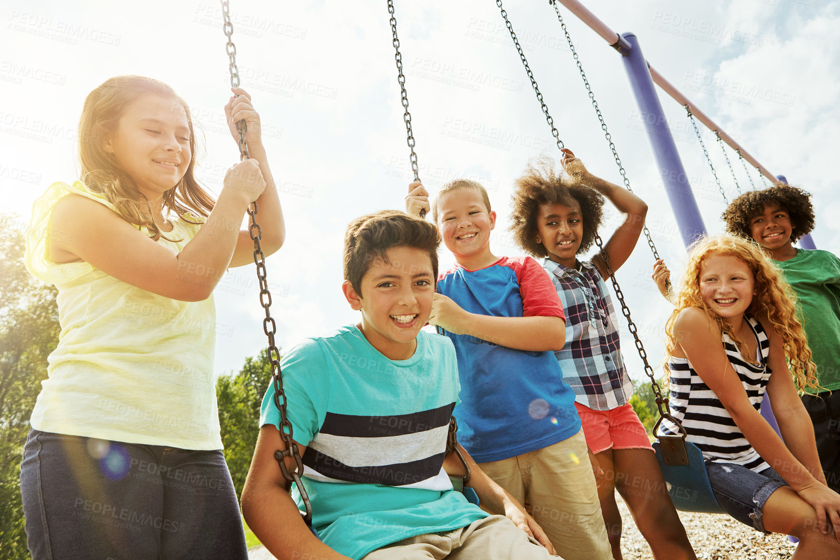 Buy stock photo Cropped shot of a group of young children playing together at the park