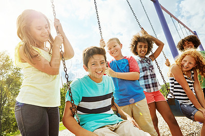 Buy stock photo Cropped shot of a group of young children playing together at the park