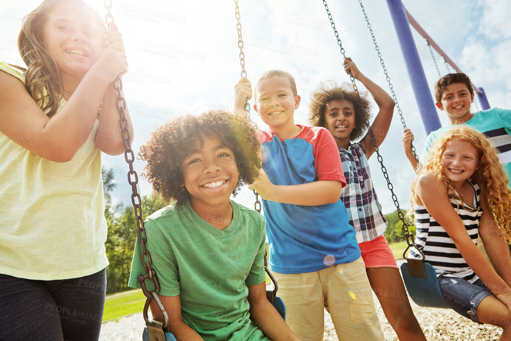 Buy stock photo Portrait of a group of young children playing together at the park