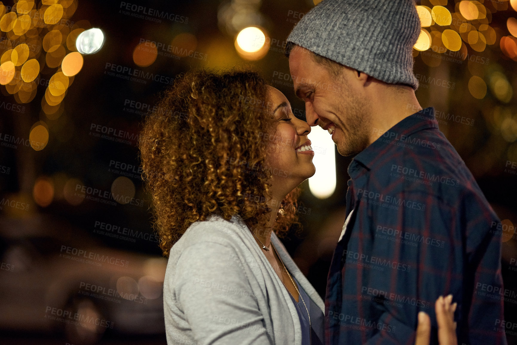 Buy stock photo Cropped shot of a young couple out on a date in the city