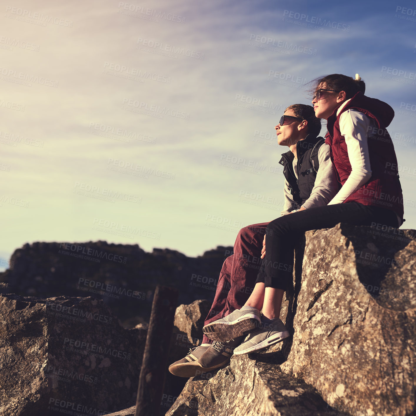 Buy stock photo Relax, view or couple on mountain peak for travel, outdoor adventure or hiking journey in nature. Love, memory or people on rocks together for holiday vacation, trip or trekking to explore in park