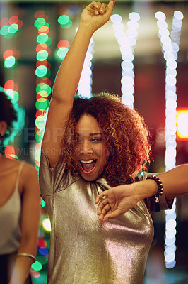 Buy stock photo Shot of a young woman having fun on the dance floor