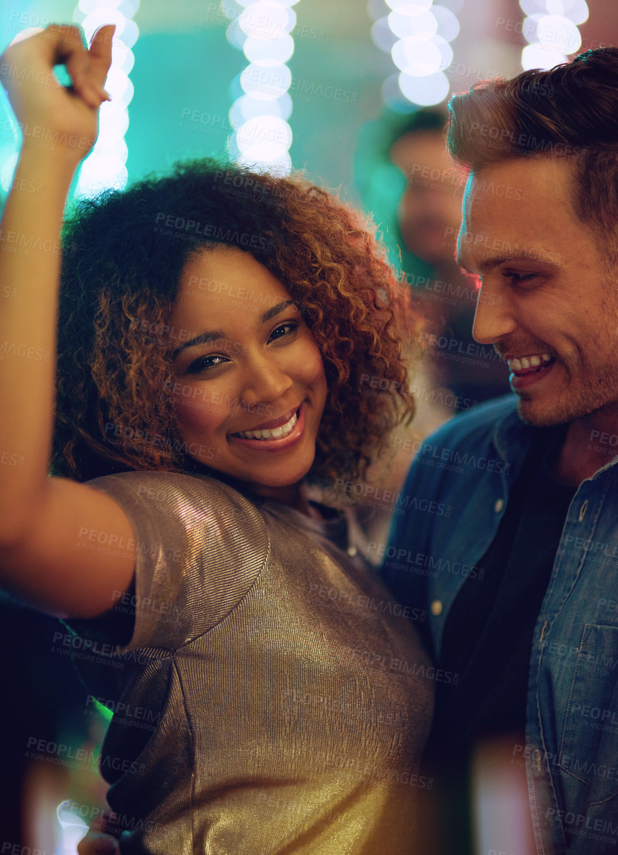 Buy stock photo Shot of a young couple having fun on the dance floor