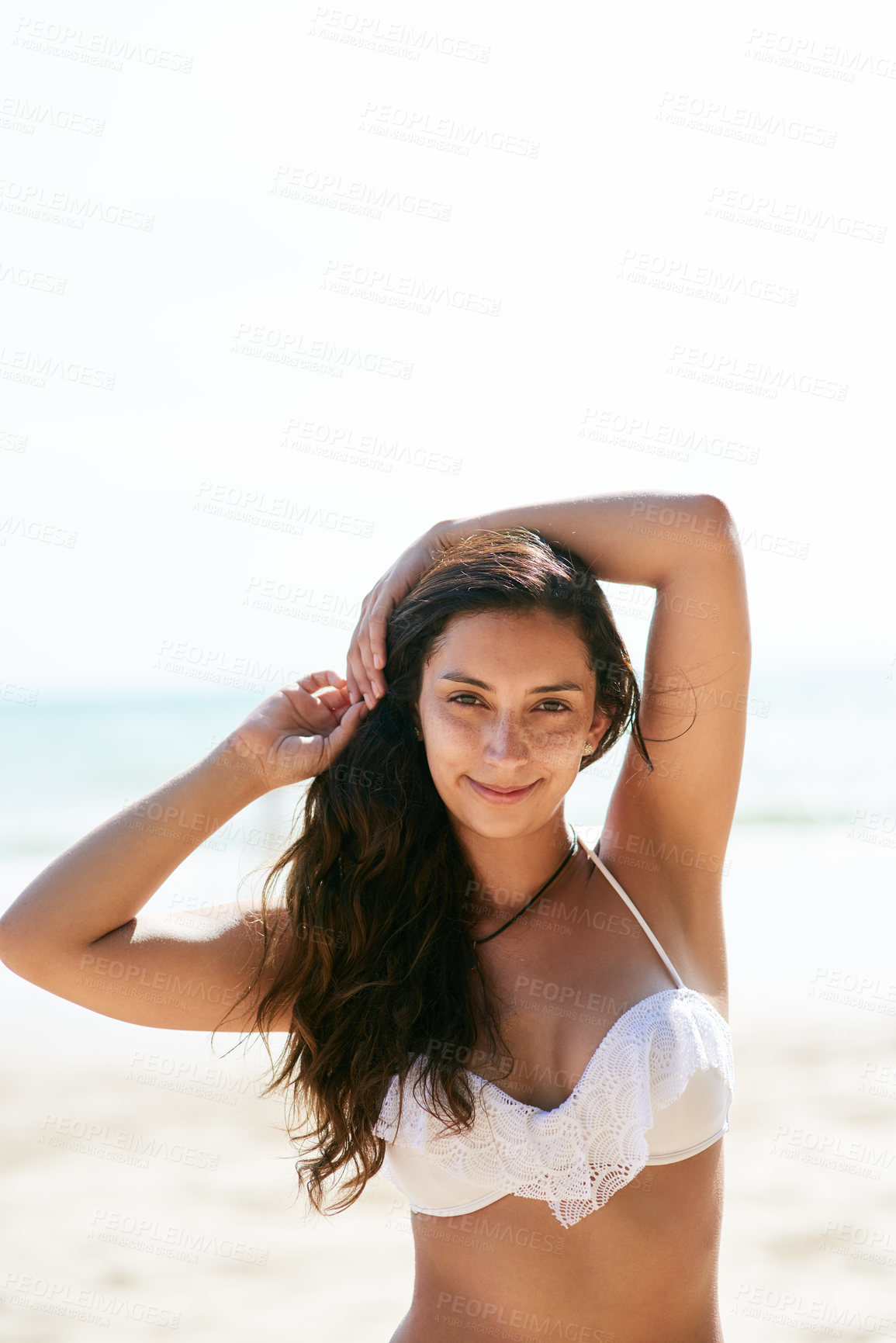 Buy stock photo Closeup shot of a beautiful young woman posing on the beach