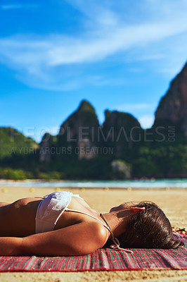 Buy stock photo Shot of a beautiful young woman relaxing on the beach