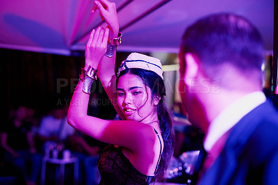 Buy stock photo Shot of a seedy businessman watching a woman dancing in a Thai nightclub