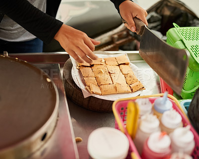 Buy stock photo Shot of an unidentifiable food vendor in Thailand preparing a tasty snack