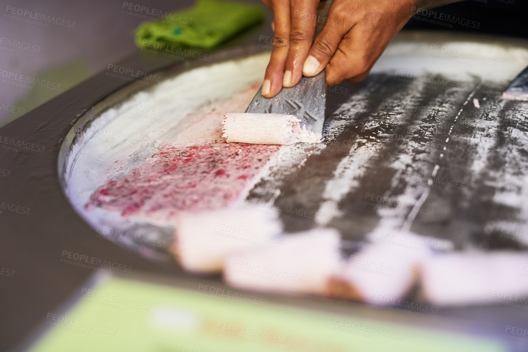 Buy stock photo Shot of an unidentifiable food vendor preparing a sweet treat at a market stall
