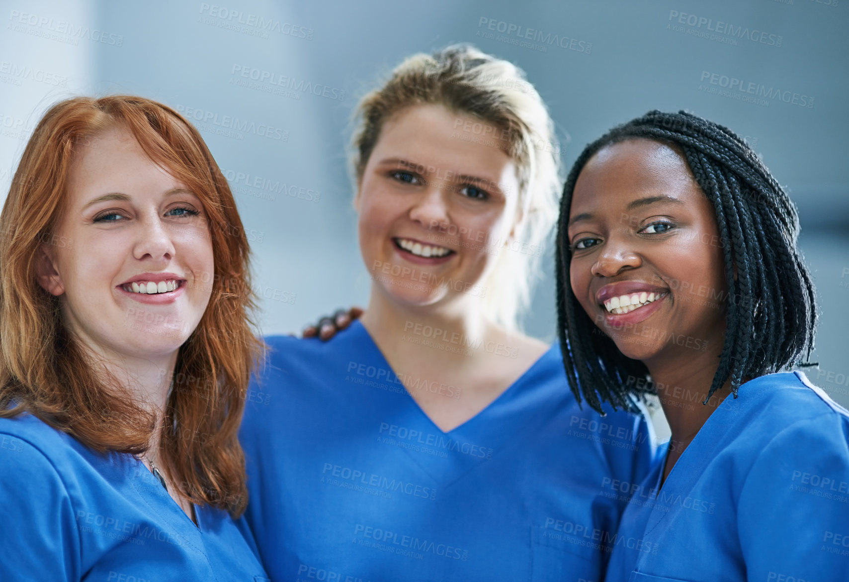 Buy stock photo Portrait of a team of confident young surgeons working in a hospital