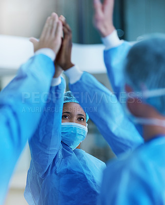 Buy stock photo Shot of a team of surgeons giving each other a high five