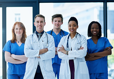 Buy stock photo Portrait of a team of confident young doctors working in a hospital