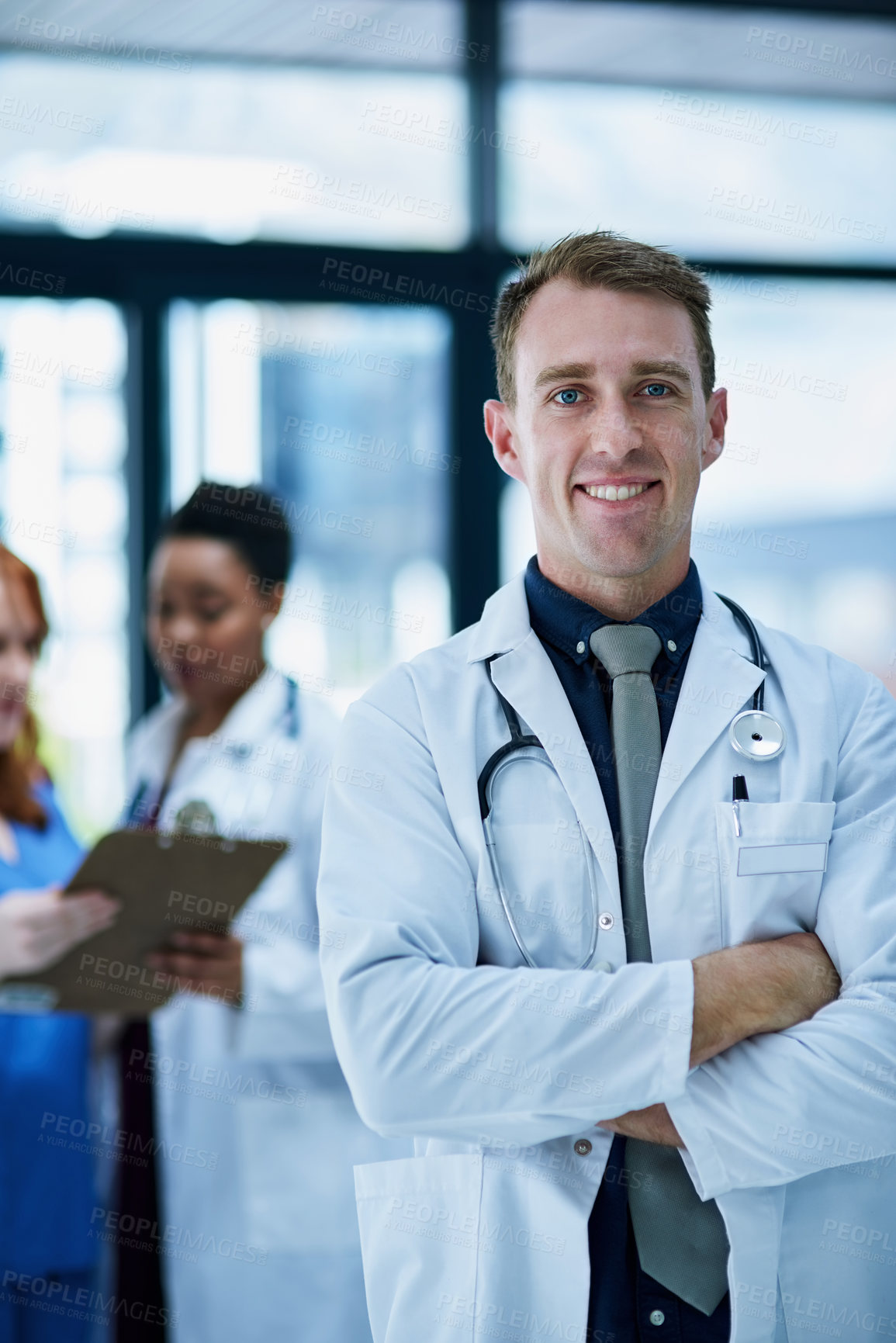 Buy stock photo Portrait of a confident young doctor working in a hospital