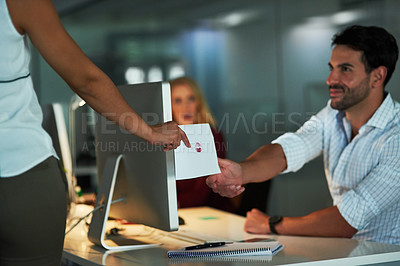 Buy stock photo Shot of a love note being passed from one colleague to another