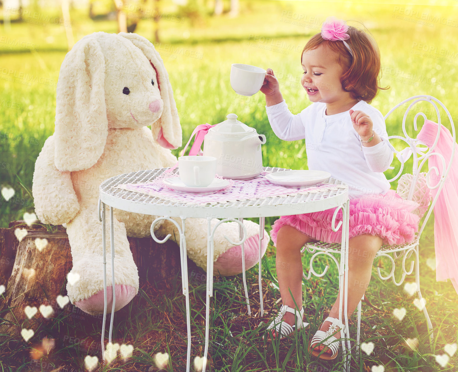 Buy stock photo Girl, kid and teddy bear in park with tea party for fun, celebration and playing outdoor in nature. Happy, fantasy or child with toy, smile or princess outfit in garden with cup and flowers in lawn