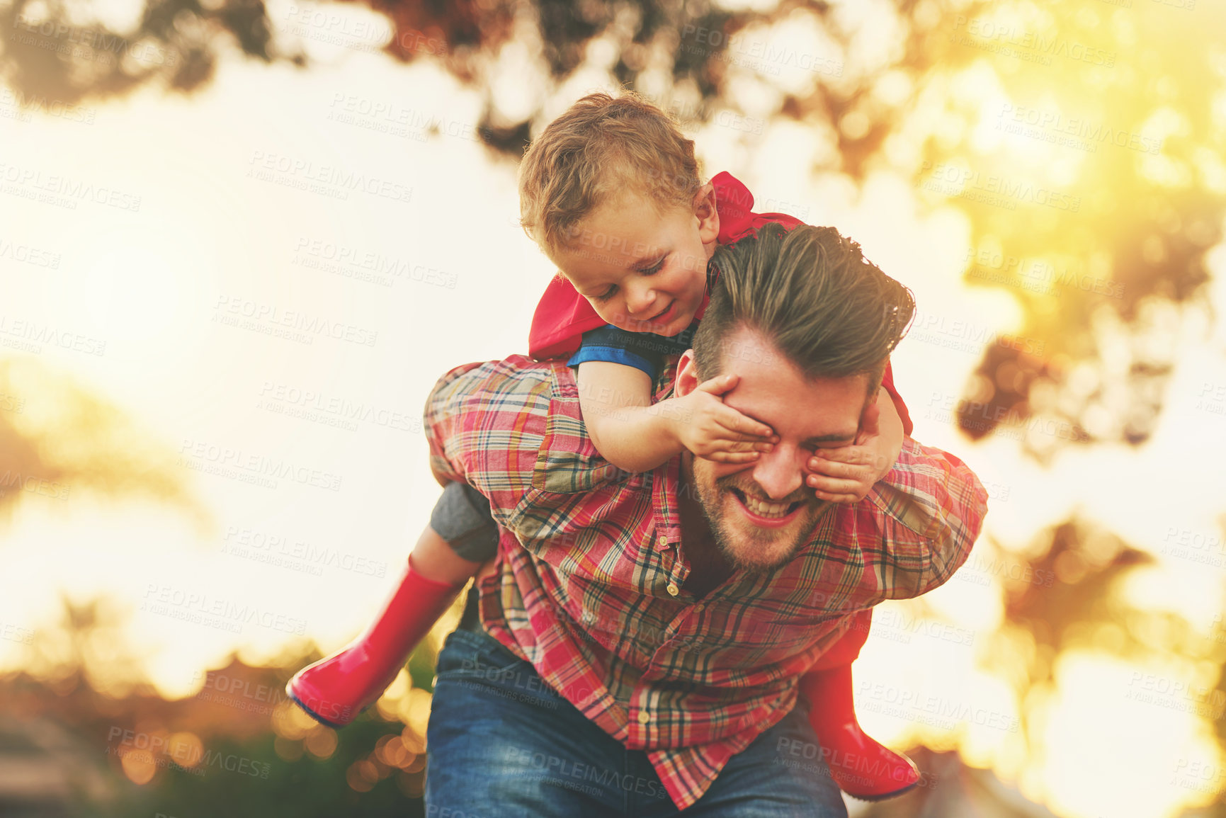 Buy stock photo Piggyback, father and child with hands over eyes in garden for games, family and happiness in nature for holiday. Man, kid and support in backyard for learning, growth and development with care  