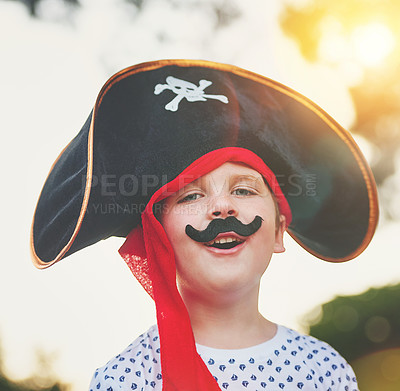 Buy stock photo Portrait of a cute little boy posing outside while dressed up like a pirate