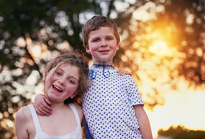 Buy stock photo Shot of a little boy and his sister standing outside
