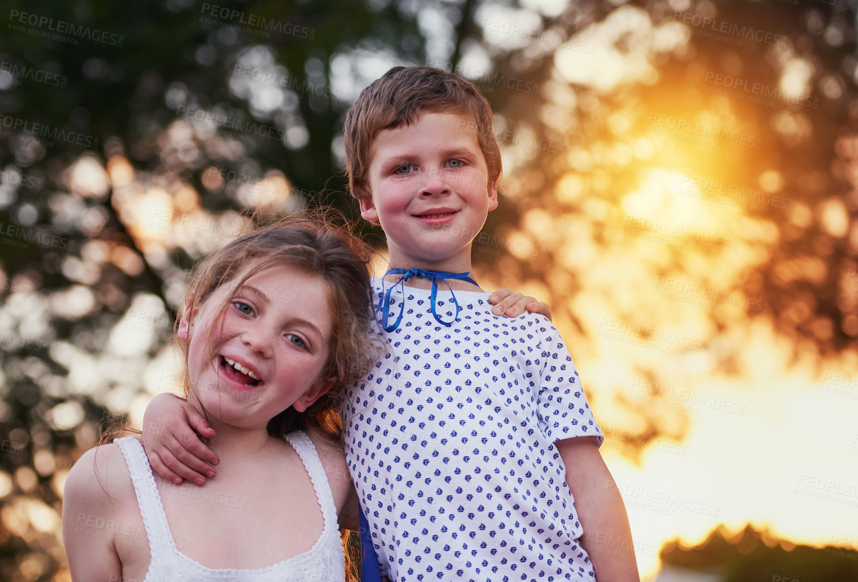 Buy stock photo Children, portrait and siblings hug in a garden with love, trust and bonding on vacation at sunset. Happy, face and girl with boy in a backyard with costume for games, fun and neighborhood Halloween