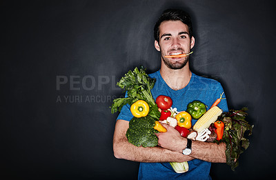 Buy stock photo Healthy, portrait of young man with vegetables and in black background. Vegan lifestyle or nutrition, food for a diet and male person isolated in studio backdrop with groceries or ingredients