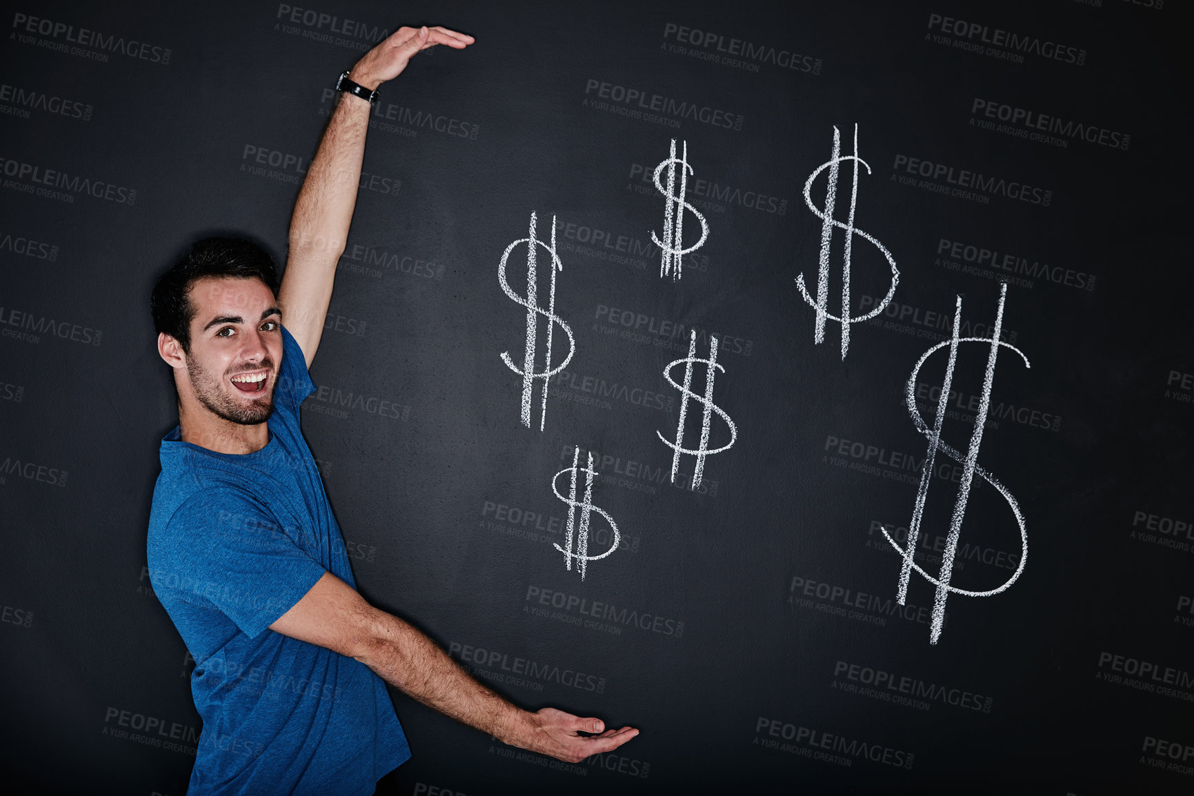 Buy stock photo Studio portrait of a young man gesturing over an illustration of a dollars against a dark background