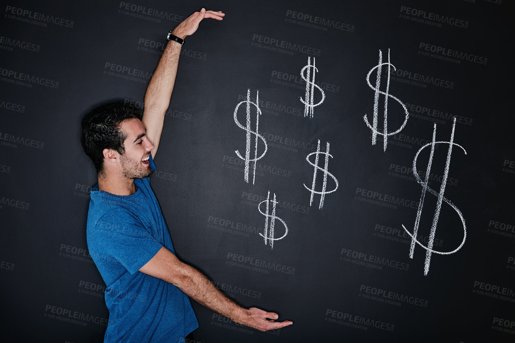 Buy stock photo Studio shot of a young man gesturing over an illustration of a dollars against a dark background