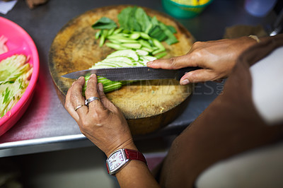 Buy stock photo Hands, knife and chopping board with cutting for preparation in home for health with fresh vegetables. Person, technique and professional chef cooking for nutrition with healthy topical food for diet