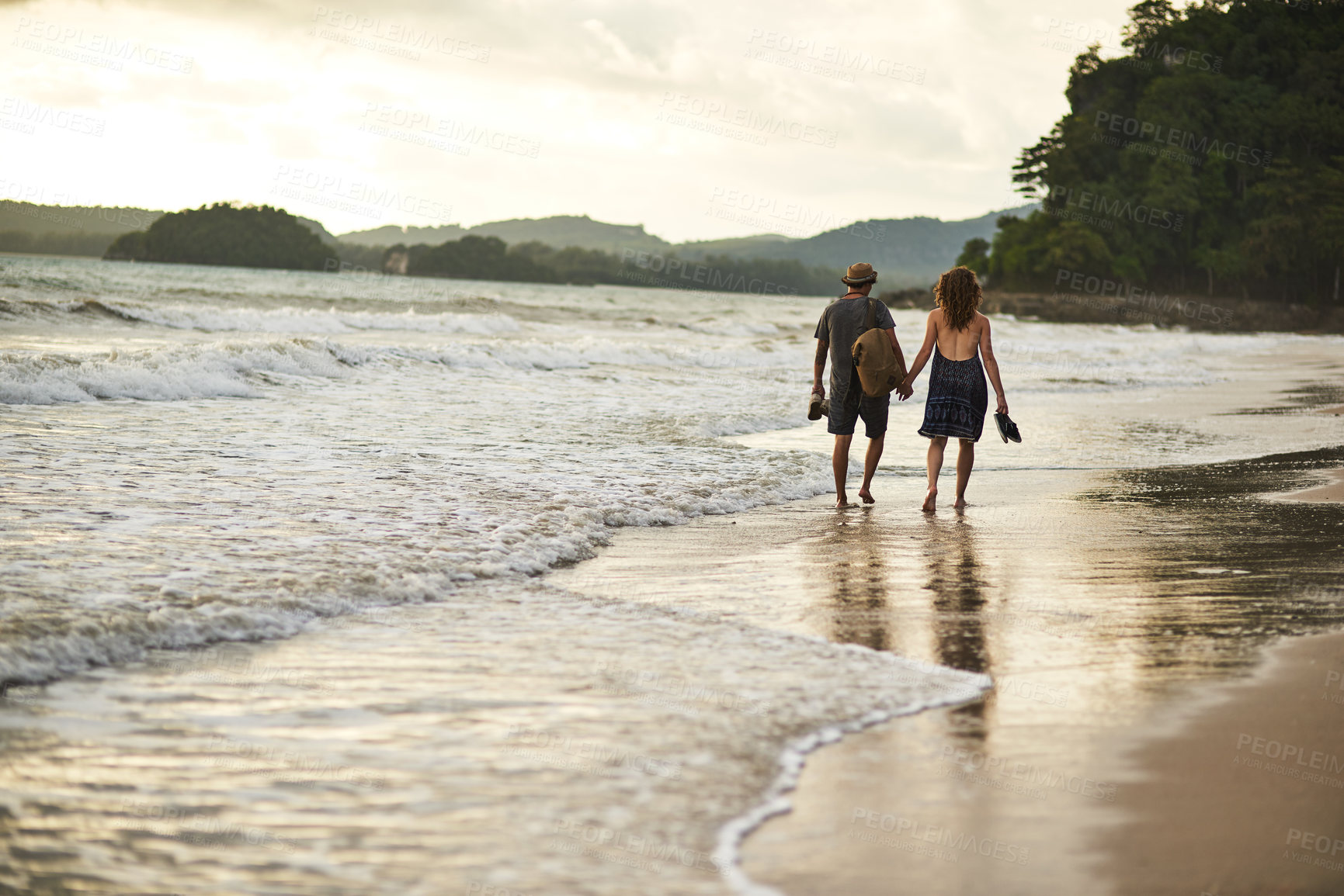 Buy stock photo Walking, couple and holding hands at beach on vacation, back and travel to Bali for adventure at sea. People, bonding and together in outdoor nature, tropical date and support on holiday by ocean