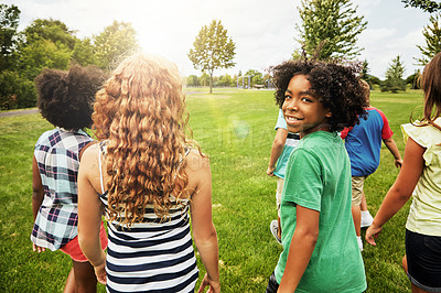 Buy stock photo Portrait of a young boy hanging out with his friends outside