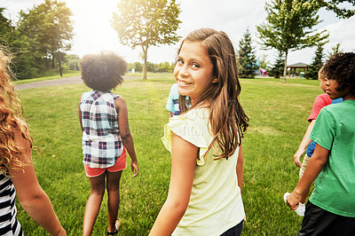 Buy stock photo Portrait of a young girl hanging out with her friends outside