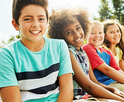 Buy stock photo Portrait, outdoor and children on bench, diversity and playful with summer, joy and weekend break. Face, group and kids in park, nature or bonding together with friends, sunshine or cheerful with fun