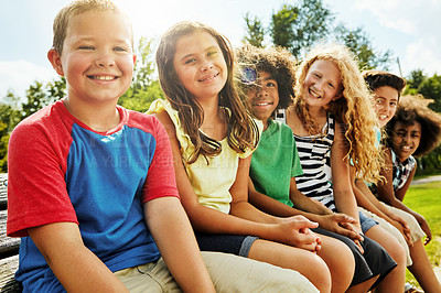 Buy stock photo Portrait, park and children on bench, smile and diversity with nature, sunshine and weekend break. Face, group and kids with summer, fun or bonding together with friends, playful and holiday with joy