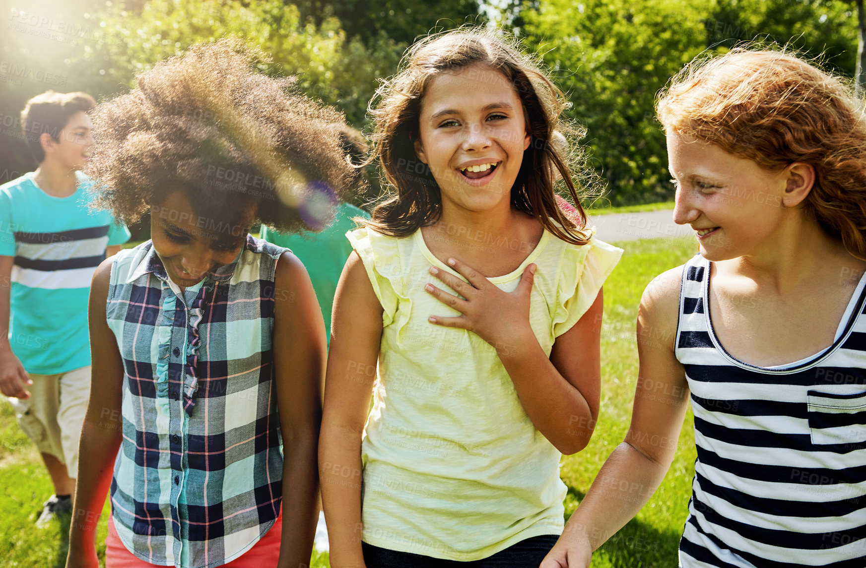 Buy stock photo Walking, happy and group of children in nature with talking, bonding or summer holiday together. Smile, conversation and girl kids outdoor in park with hang out, playing or fun on weekend break.