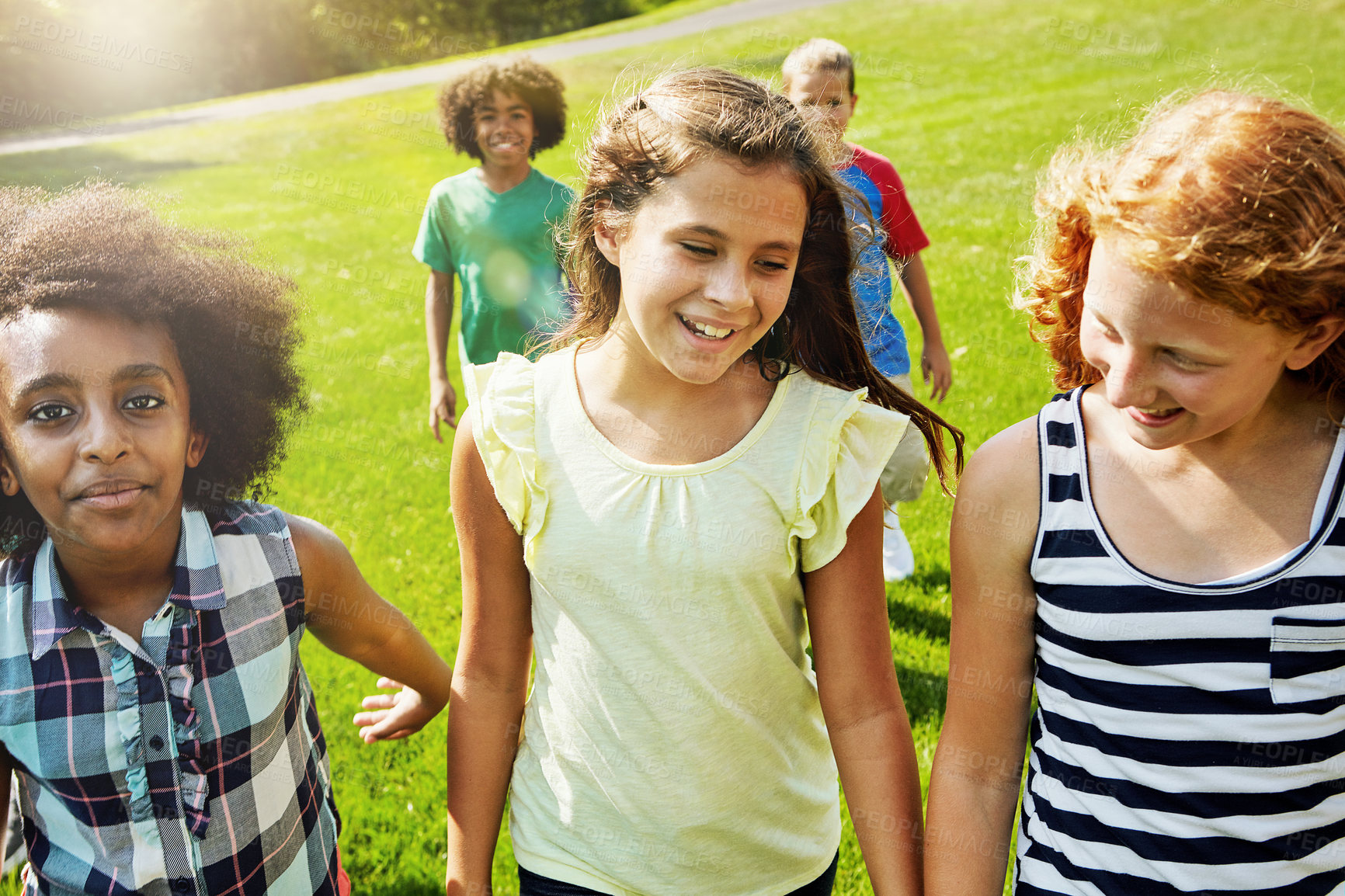 Buy stock photo Portrait of a group of diverse and happy kids hanging out together outside