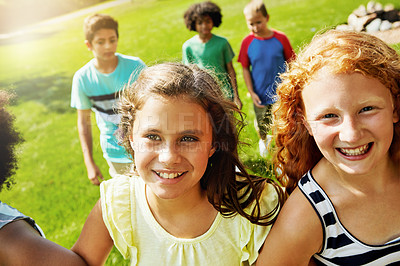 Buy stock photo Portrait of a group of diverse and happy kids hanging out together outside